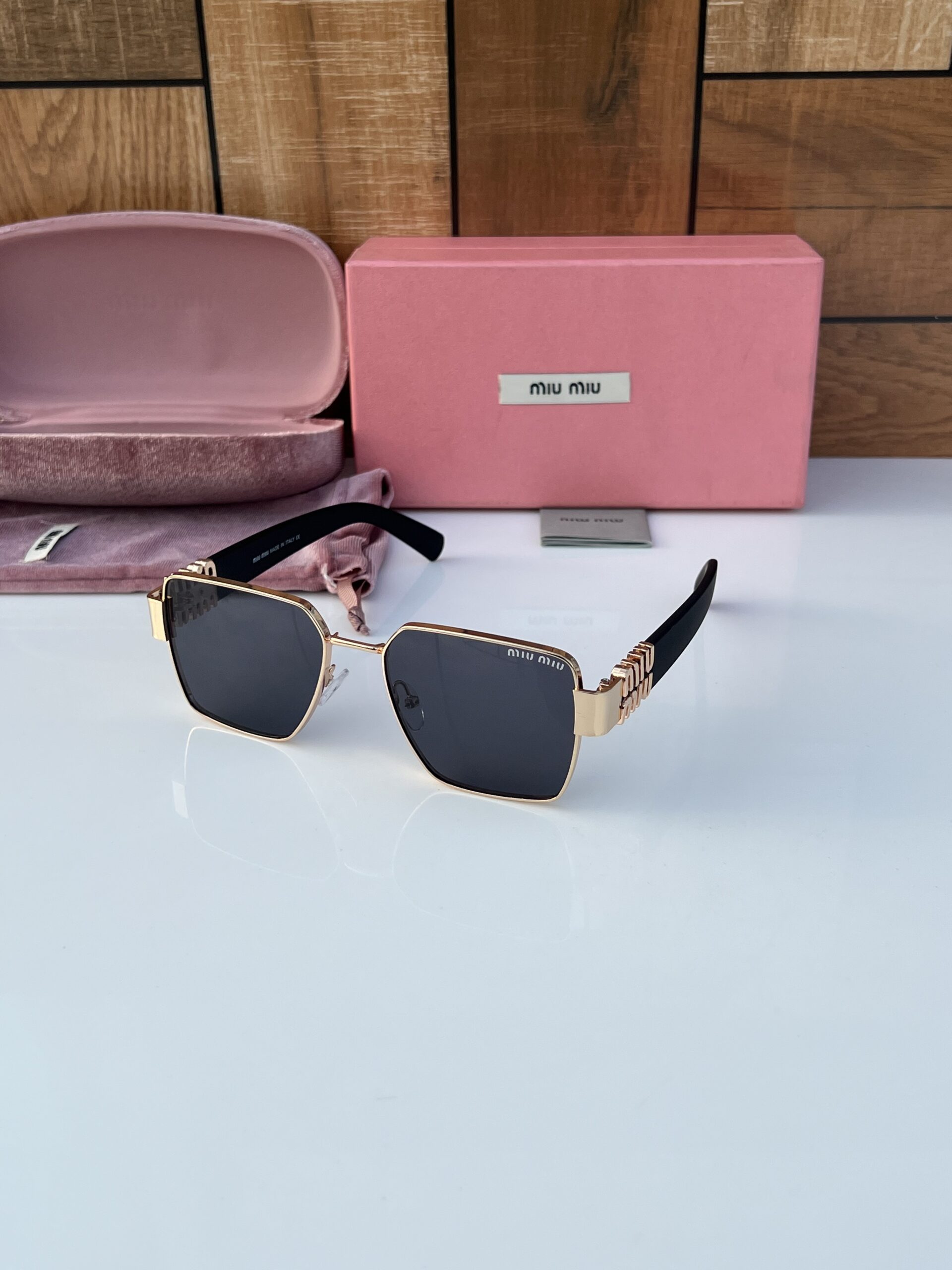 Miu miu 720 gold black